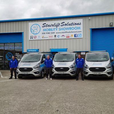 Stairlift Solutions team and vans at the mobility showroom